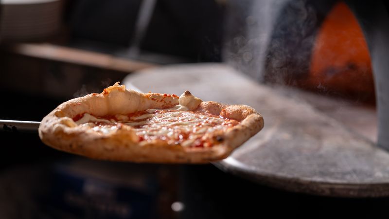 Wood-fired pizza crust at Round table pizza